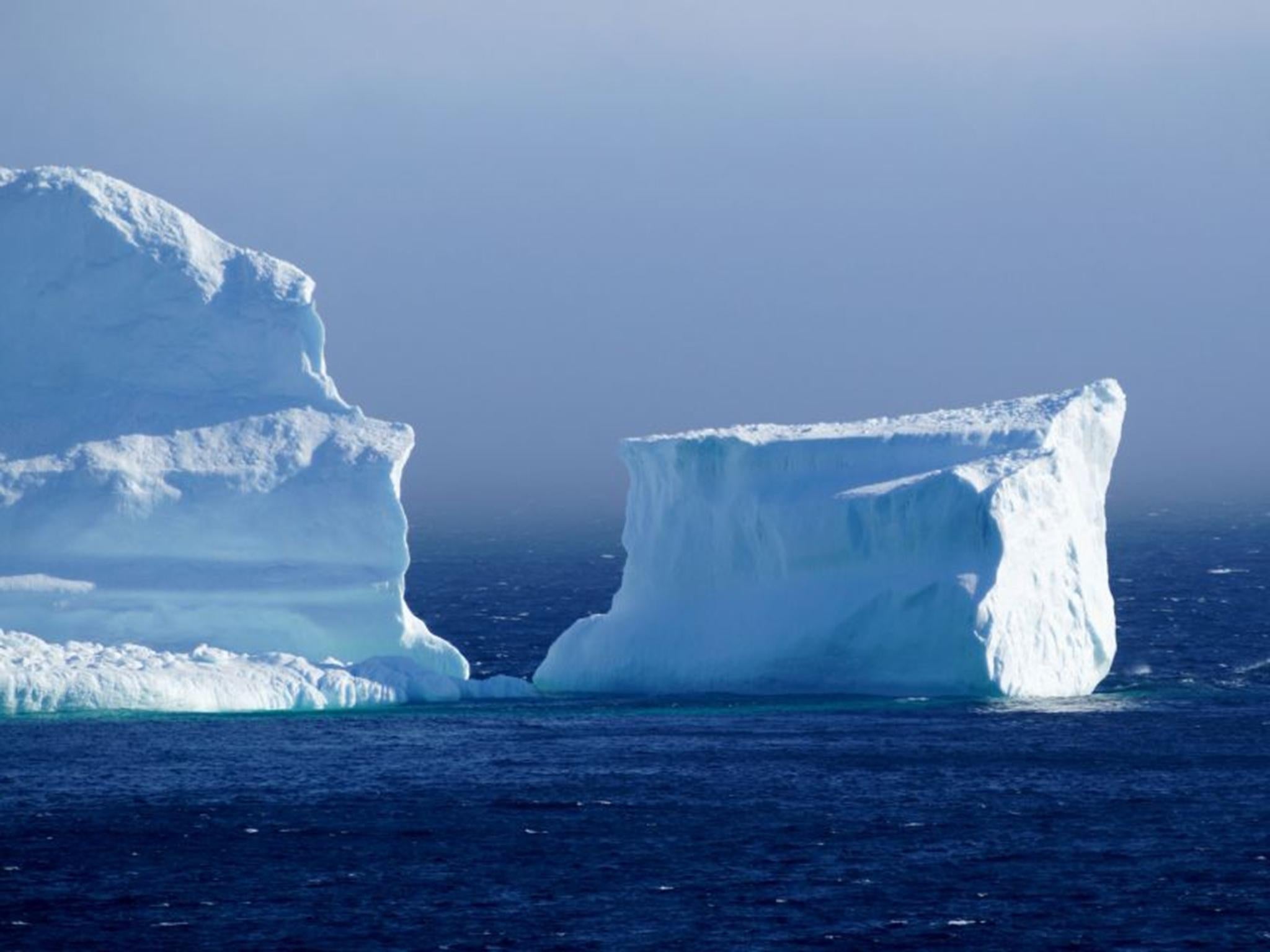 The iceberg dwarfs the town around it and even a helicopter that was supposedly parked on top