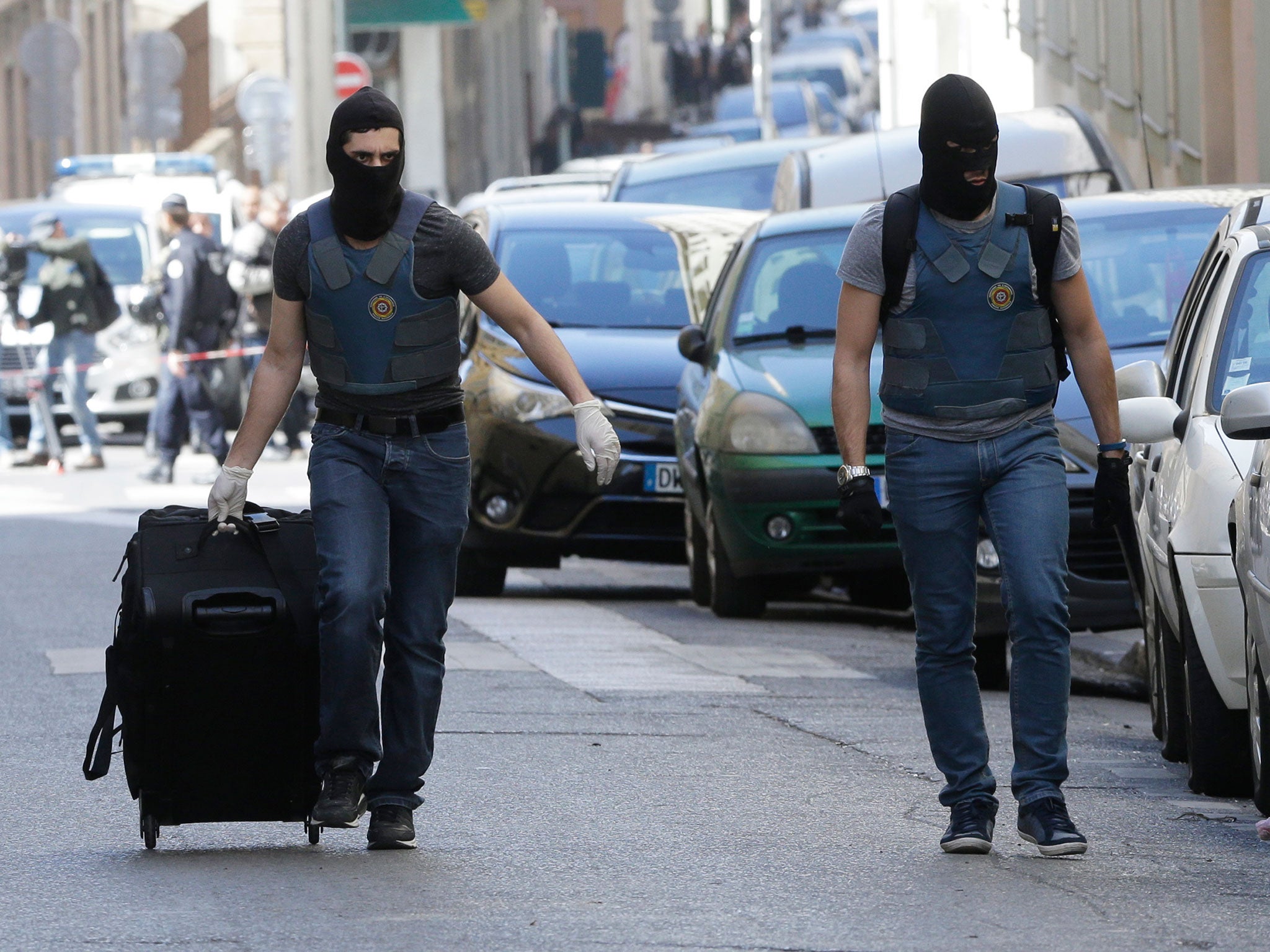 Masked elite police officers during searches in Marseille on 18 April