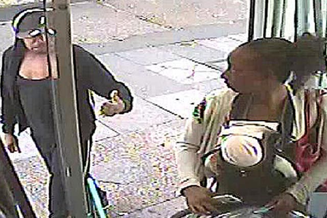 CCTV still issued by the Metropolitan Police of Rosalin Baker being given the thumbs up by Jeffrey Wiltshire as she boards a bus