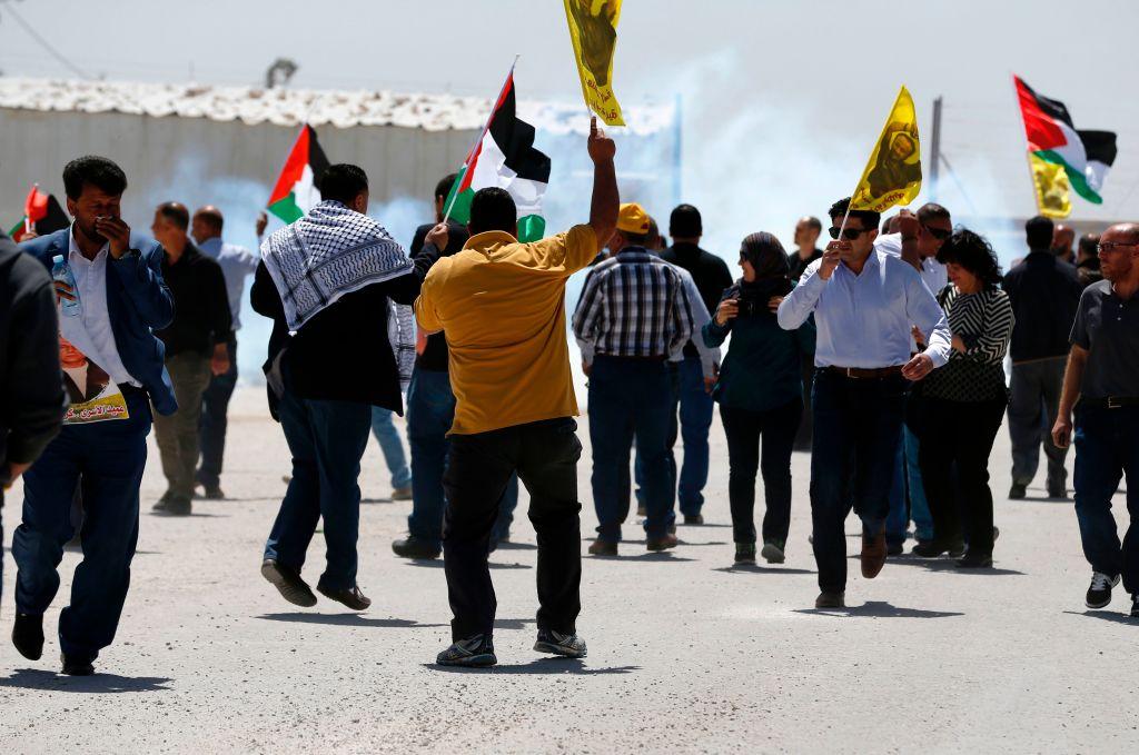 Palestinians protest in solidarity with prisoners on hunger strike in Israeli jails, in front of the Israeli-run Ofer prison in the West Bank village of Betunia on April 20, 2017