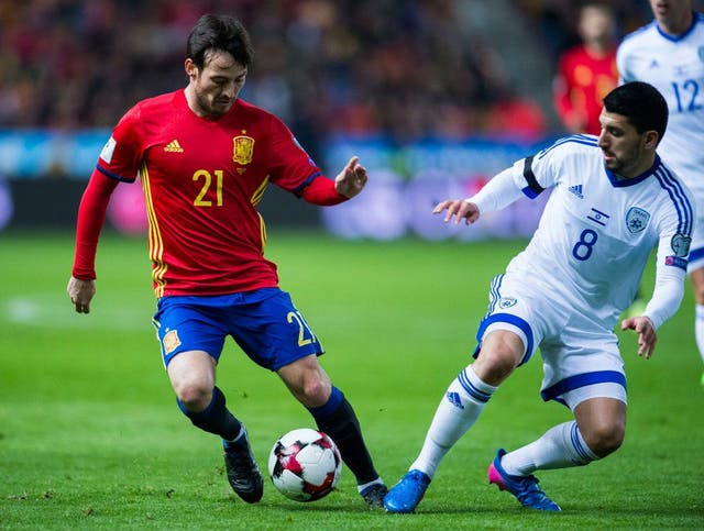 David Silva of Spain duels for the ball with Almog Cohen of Israel during the Fifa 2018 World Cup Qualifier between Spain and Israel at Estadio El Molinon on 24 March, 2017 in Gijon, Spain