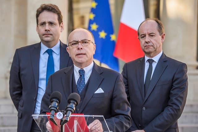 Bernard Cazeneuve (centre), flanked by interior minister Matthias Fekl (left) and justice minister Jean-Jacques Urvoas (right), outside the Elysee Palace in Paris on Friday