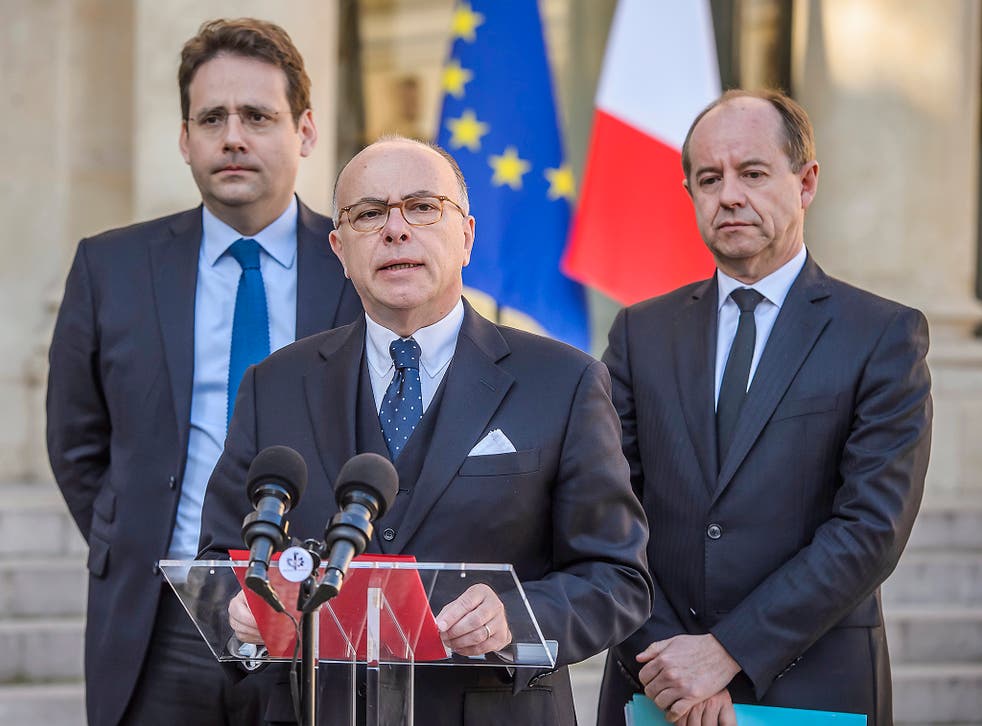 Bernard Cazeneuve (centre), flanked by interior minister Matthias Fekl (left) and justice minister Jean-Jacques Urvoas (right), outside the Elysee Palace in Paris on Friday