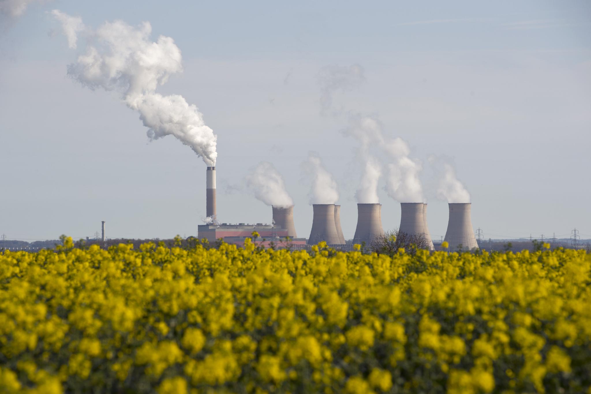 Smoke rises from the cooling towers of Cottam coal-fired power station, near Darlton, Nottinghamshire