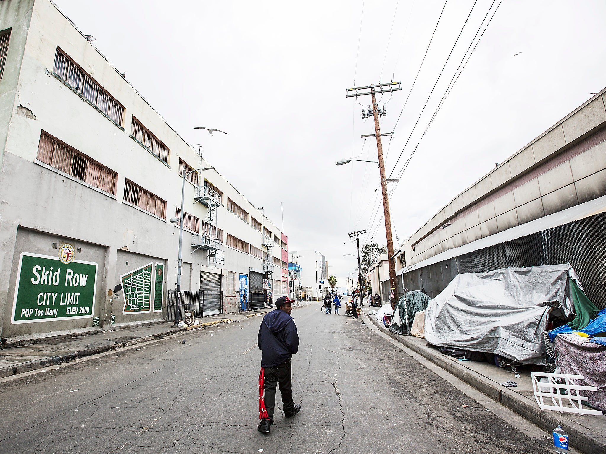 Skid Row in downtown Los Angeles.  Skid Row has LA's largest concentration of homeless people who regularly camp on the sidewalks in tents and cardboard boxes