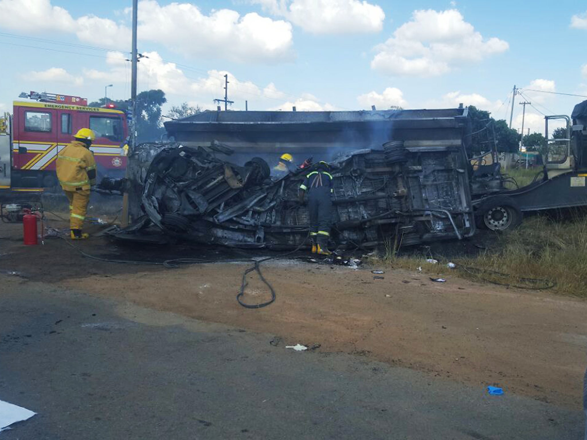 A truck crashed into the bus carrying school children home. After the impact the bus burst into flames