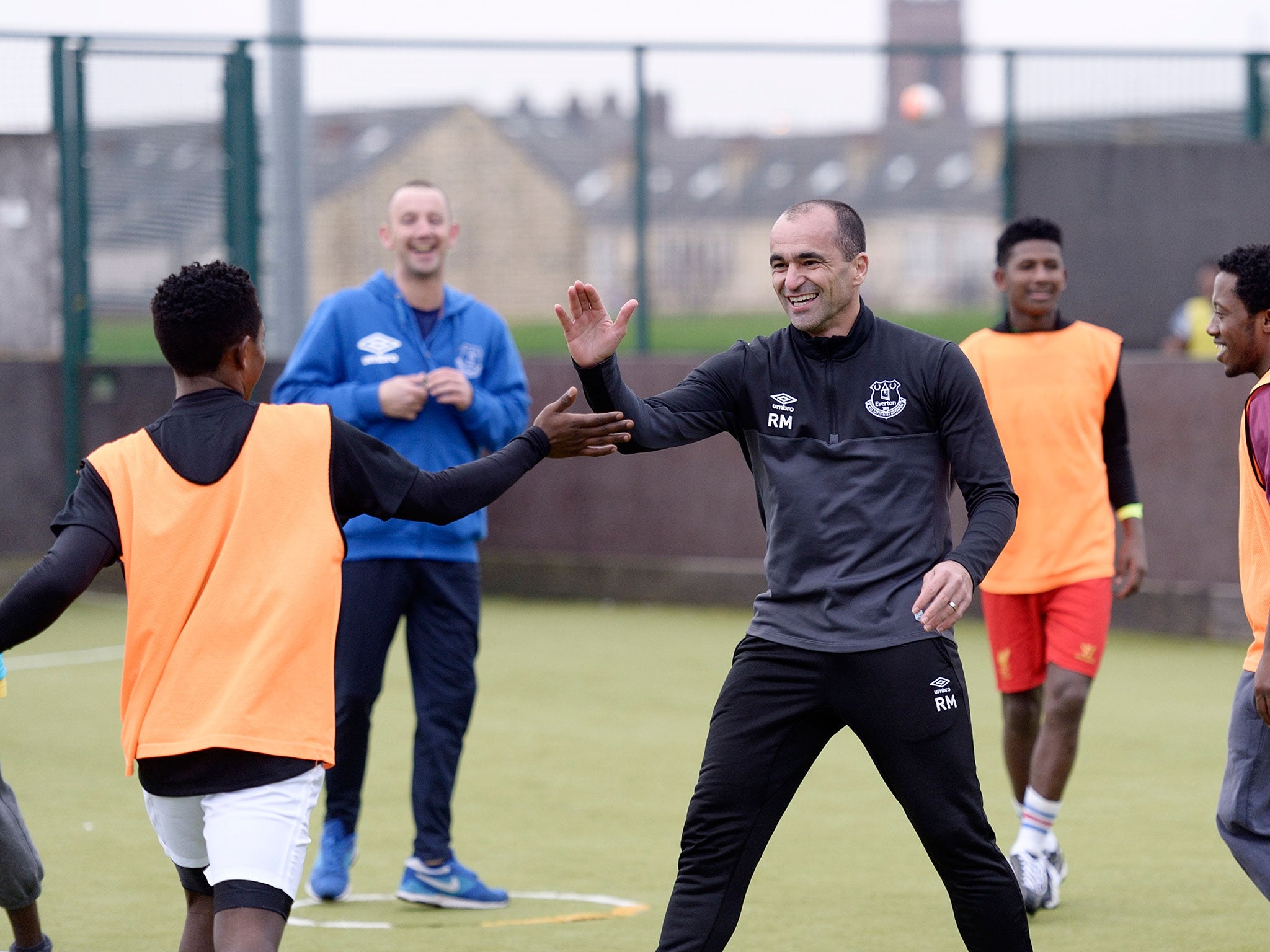 Vieira in training with Martinez at one of Everton's coaching sessions for refugees