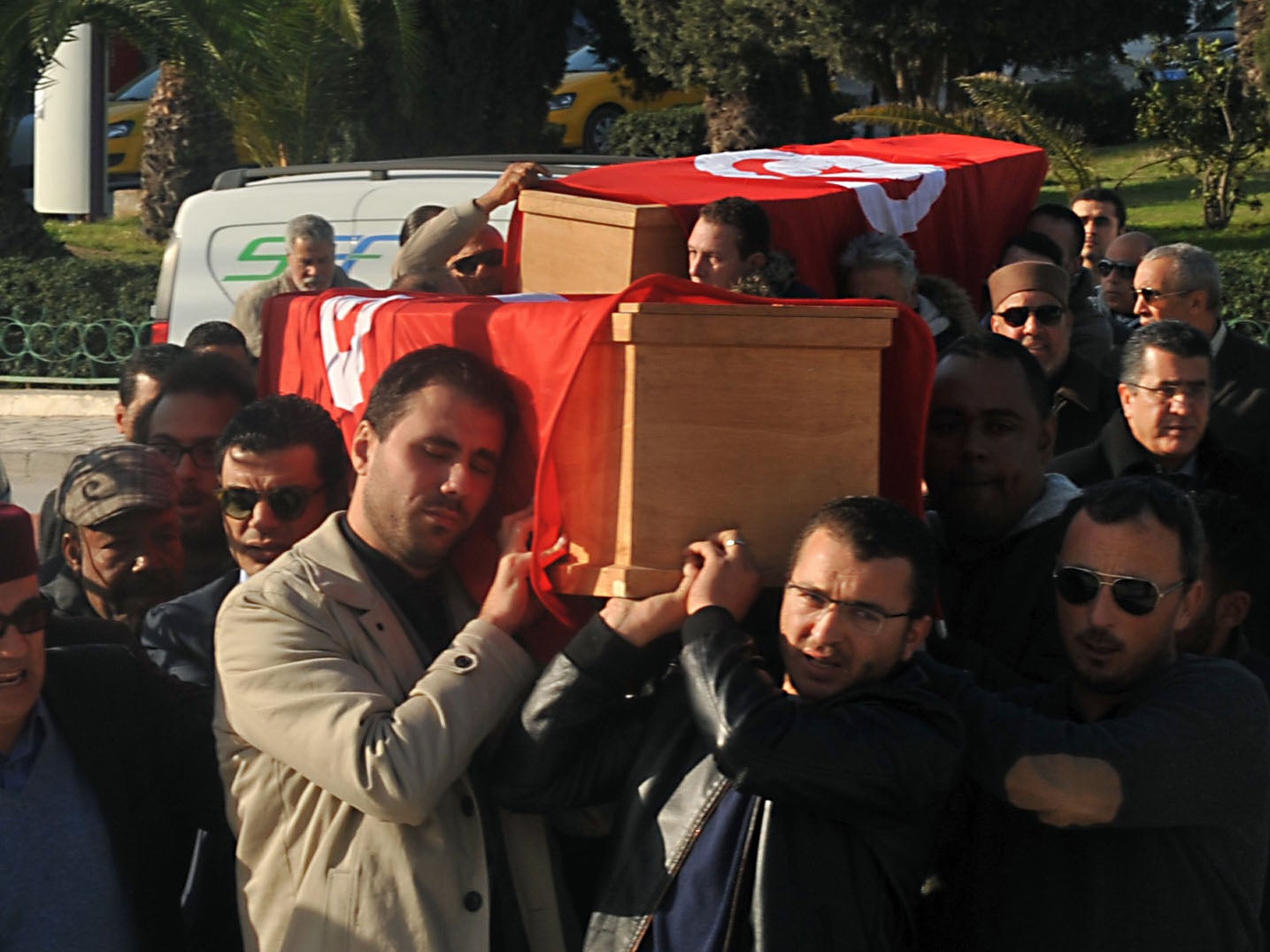 Relatives and friends carry the coffins of husband and wife Mohamed Azzabi and Senda Nakaa, who were victims of the Istanbul nightclub shooting on New Year's Eve, during their funeral in Tunisia