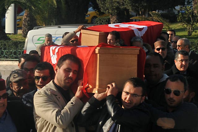 Relatives and friends carry the coffins of husband and wife Mohamed Azzabi and Senda Nakaa, who were victims of the Istanbul nightclub shooting on New Year's Eve, during their funeral in Tunisia