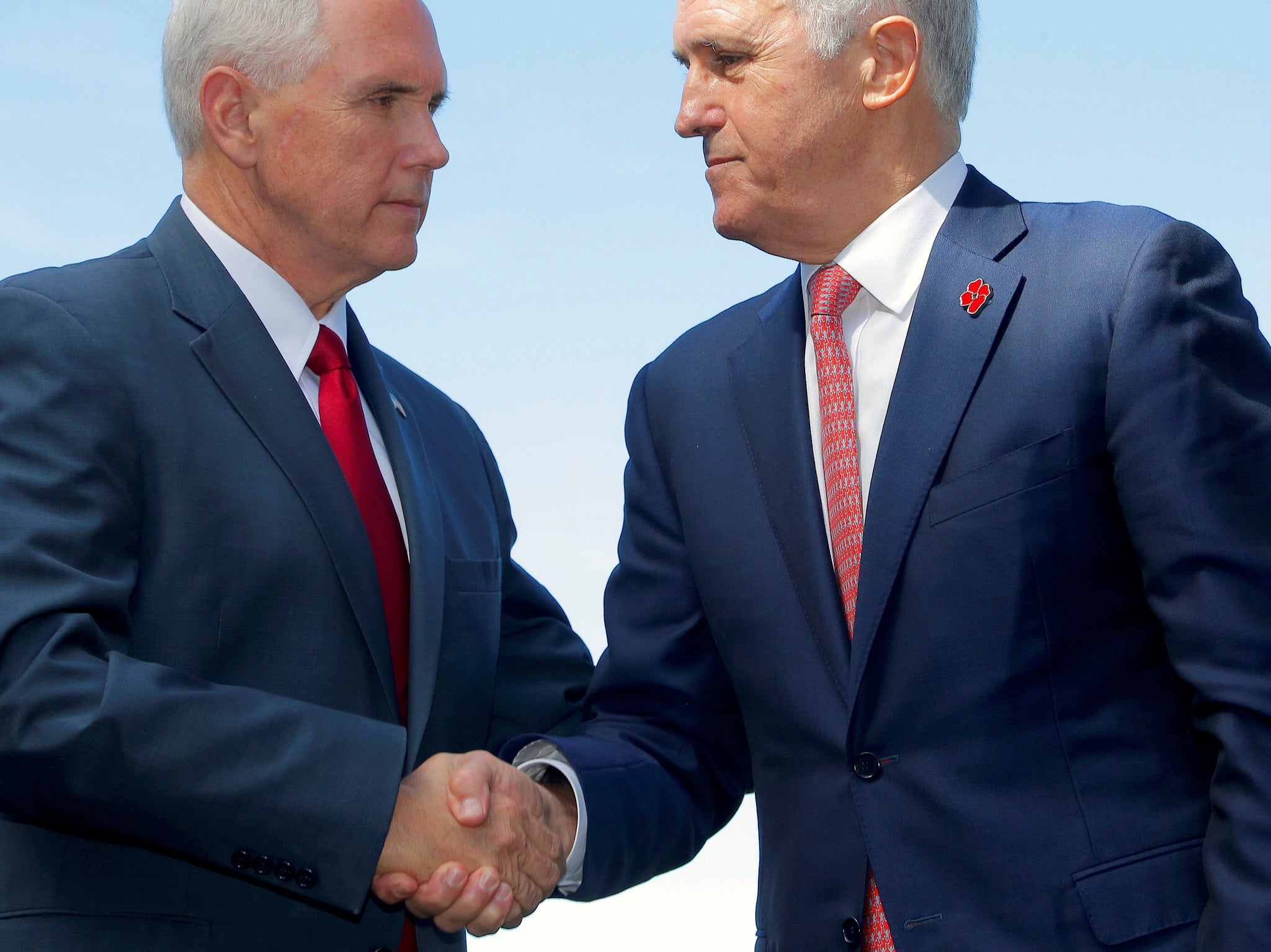 Mike Pence shook hands with Prime Minister Malcolm Turnbull after announcing a US commitment to the refugee resettlement deal