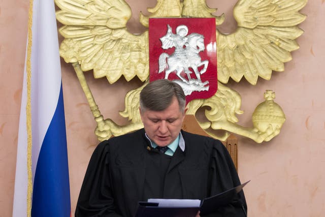 Supreme Court judge Yuri Ivanenko reads the decision in a courtroom in Moscow Thursday