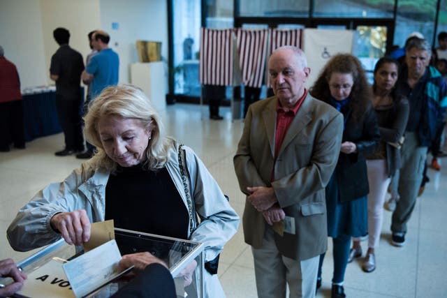 A French citizen casts her ballot at the French embassy in Washington DC