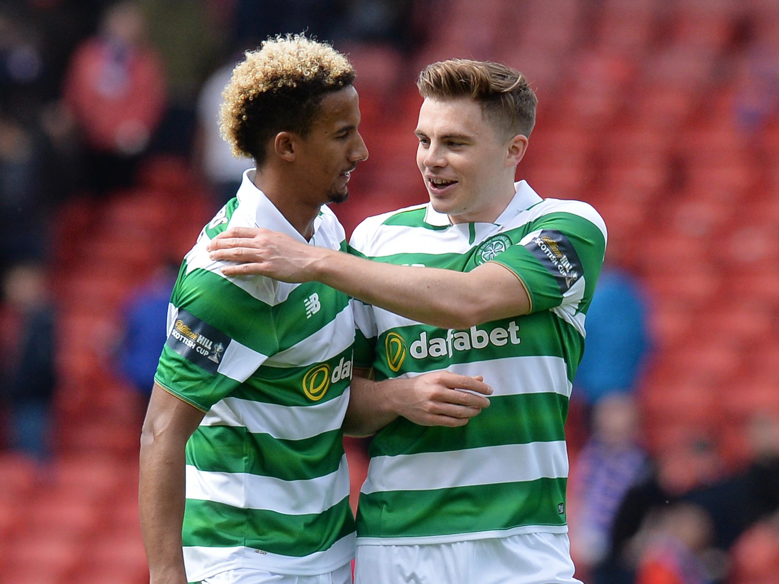 Sinclair (left) scored the second from the penalty spot