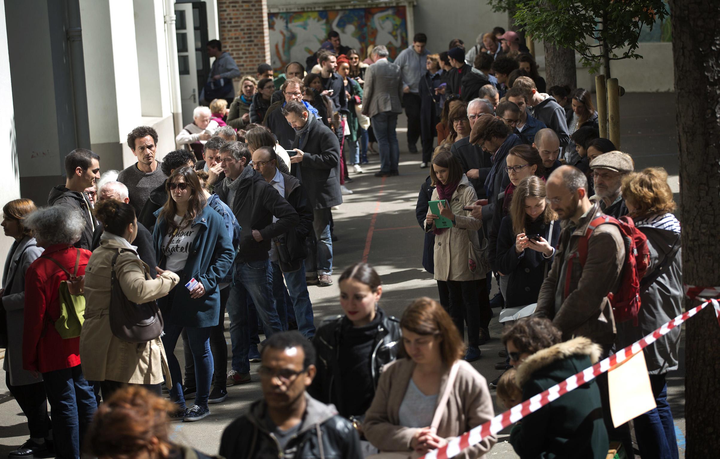 French voters queue at a Parisien polling station