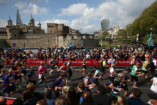 Runners make their way off Tower Bridge during the 2017 London Marathon