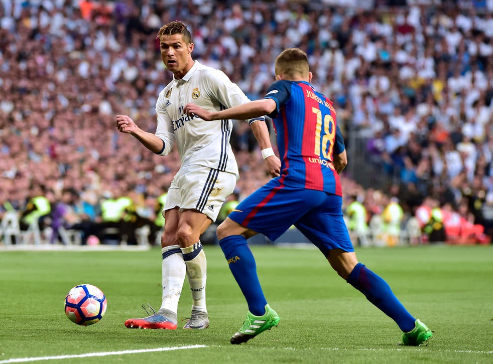 Cristiano Ronaldo knocks the ball past Jordi Alba in the opening stages