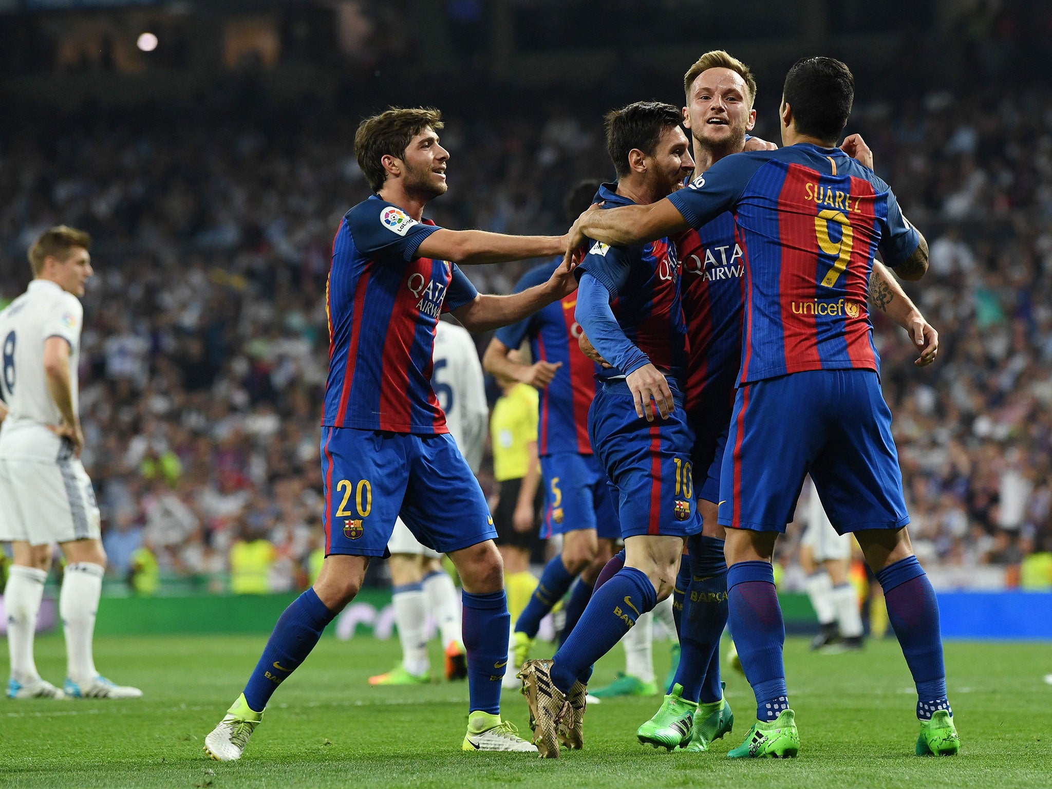 Barcelona celebrate as Lionel Messi inspired the 3-2 victory over Real Madrid