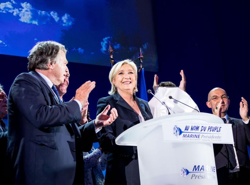 Marine Le Pen soaks up the applause from her supporters last night