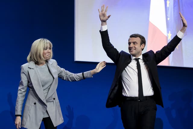 Emmanuel Macron with his wife Brigitte Trogneux addresses activists after the announcement of the French presidential election results