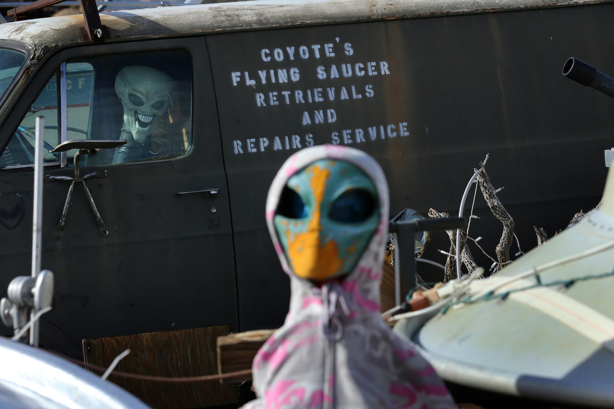 A roadside collection of alien dolls and toy UFO saucers is seen next to a roadside residence neat Jacumba, California, United States