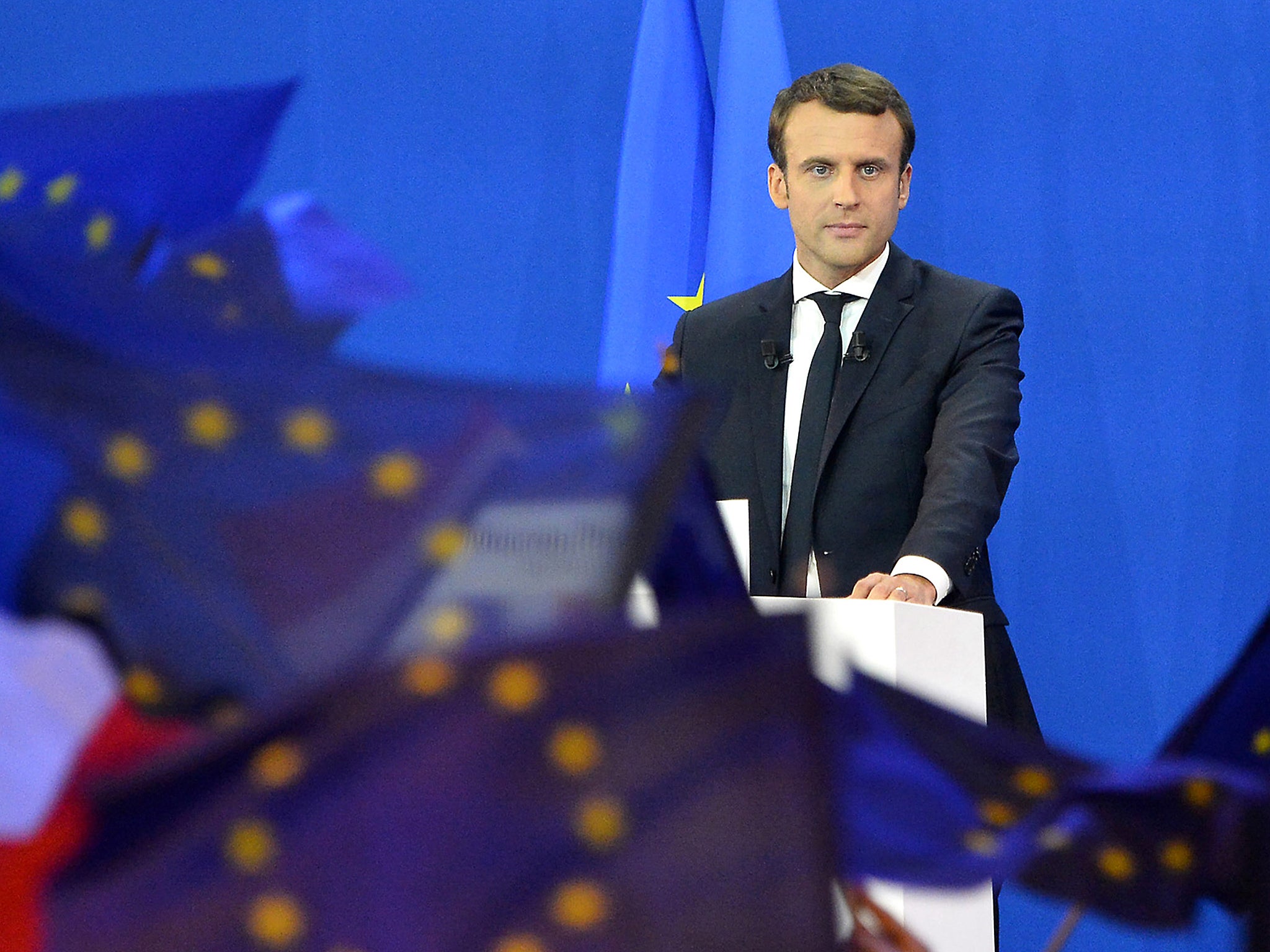 Emmanuel Macron speaks after winning a commanding lead in the first round of the French Presidential Elections