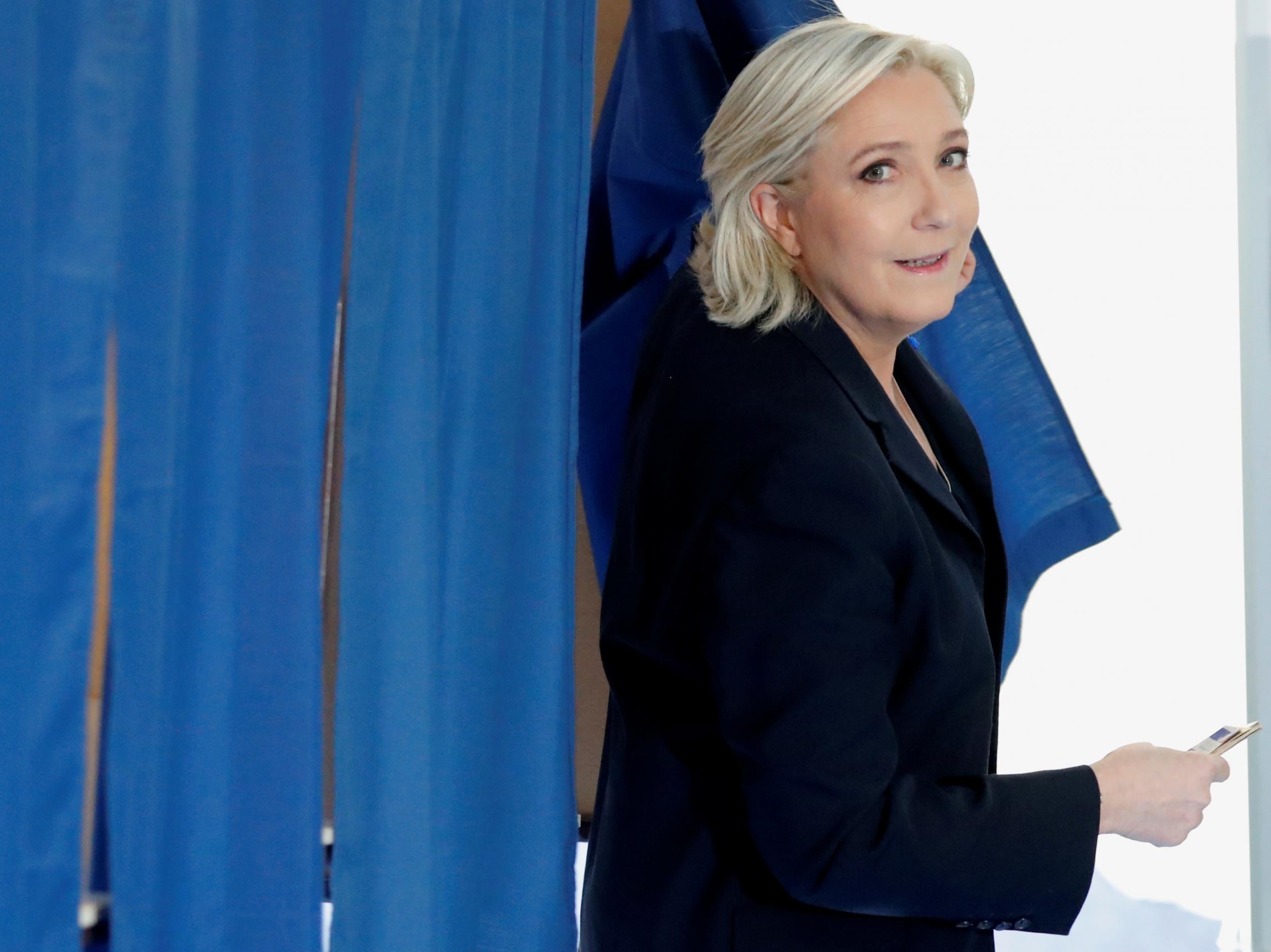 National Front leader Marine Le Pen casts her vote in yesterday's French presidential election at a polling station in Henin-Beaumont