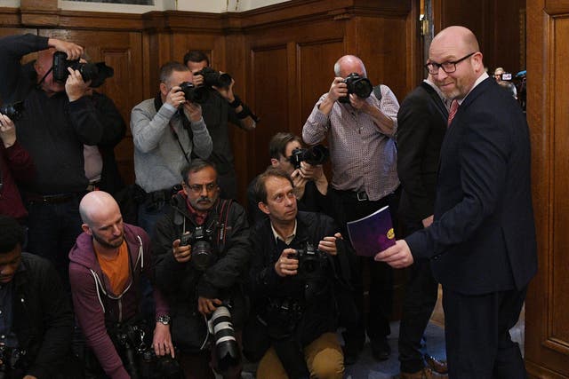 Paul Nuttall (R) arrives to deliver a party's policy announcement at Marriott County Hall London