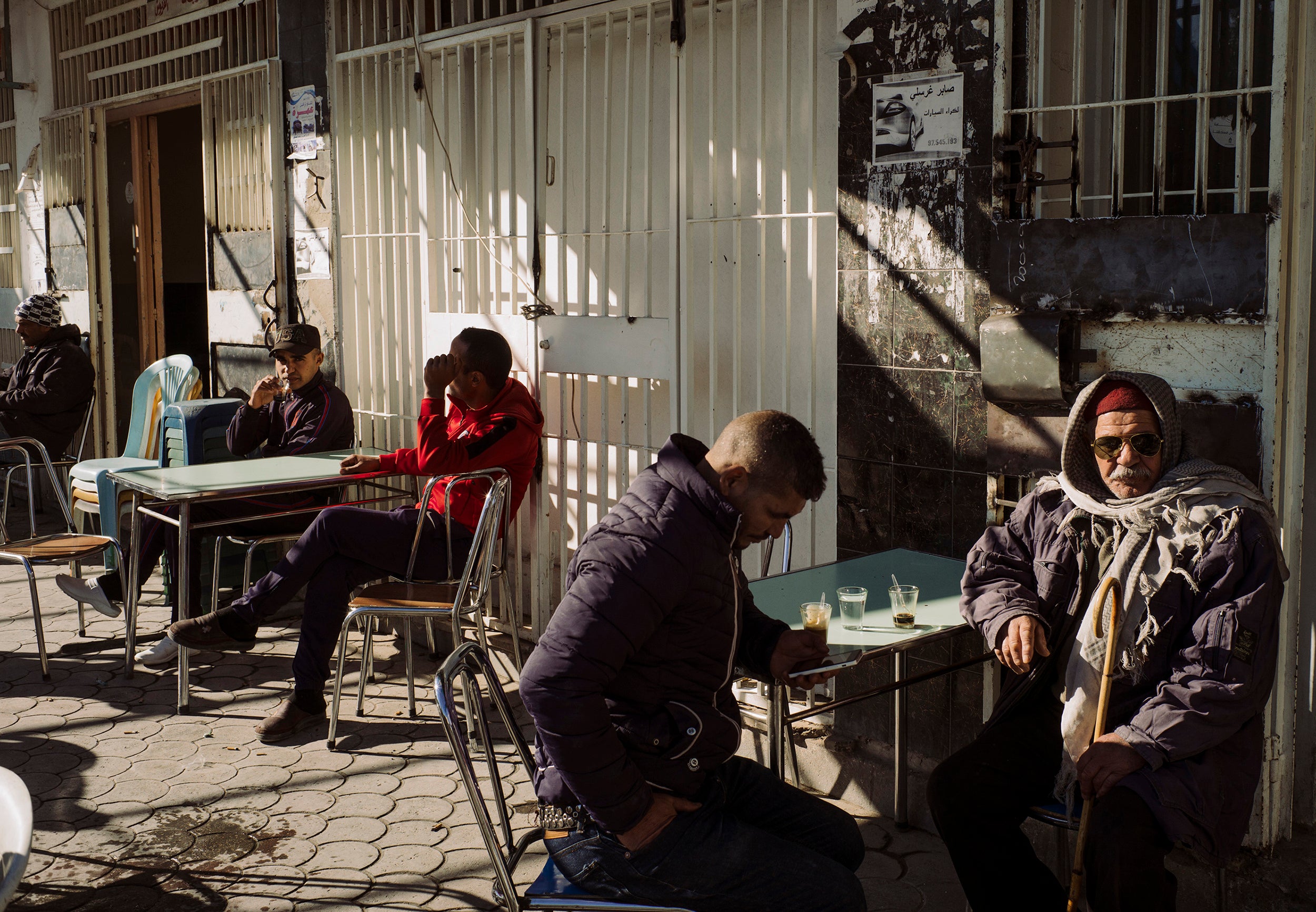 Locals congregate at a café in Kasserine's city centre
