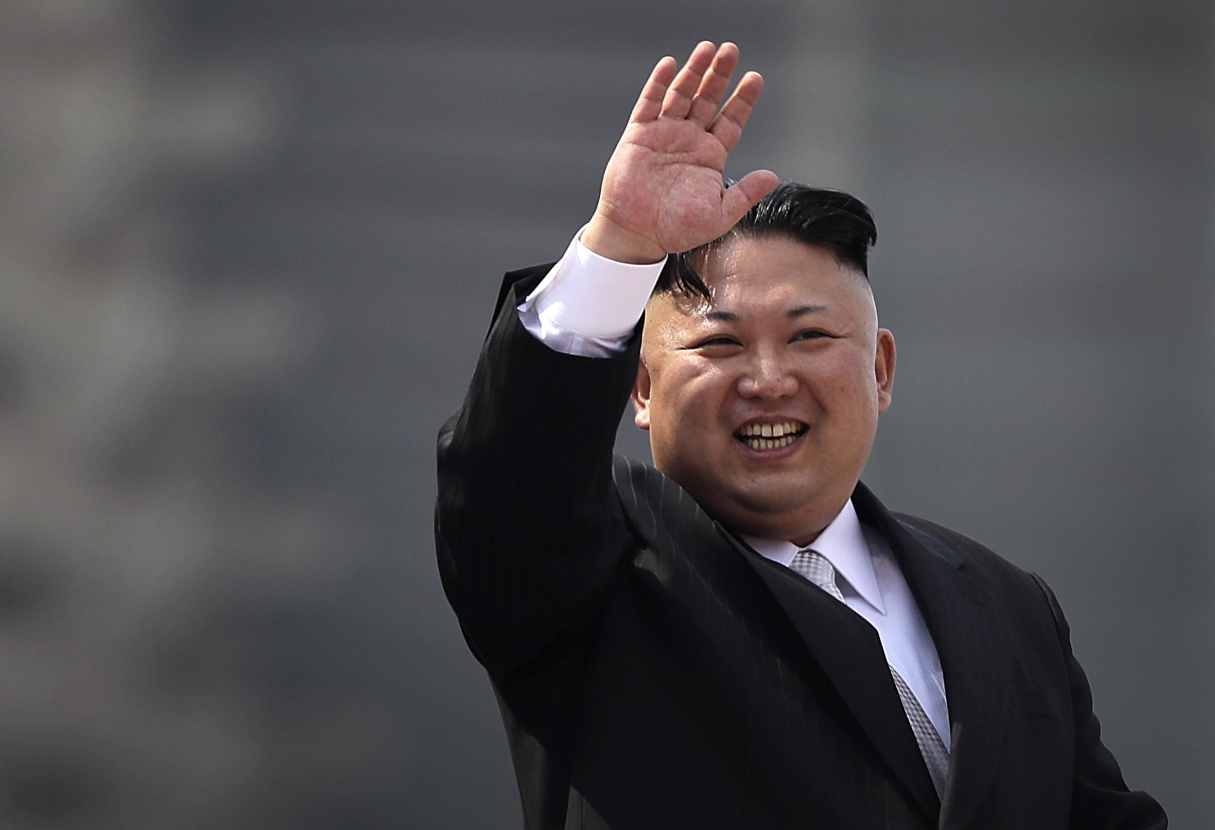 North Korean leader Kim Jong Un waves during a military parade in Pyongyang, North Korea