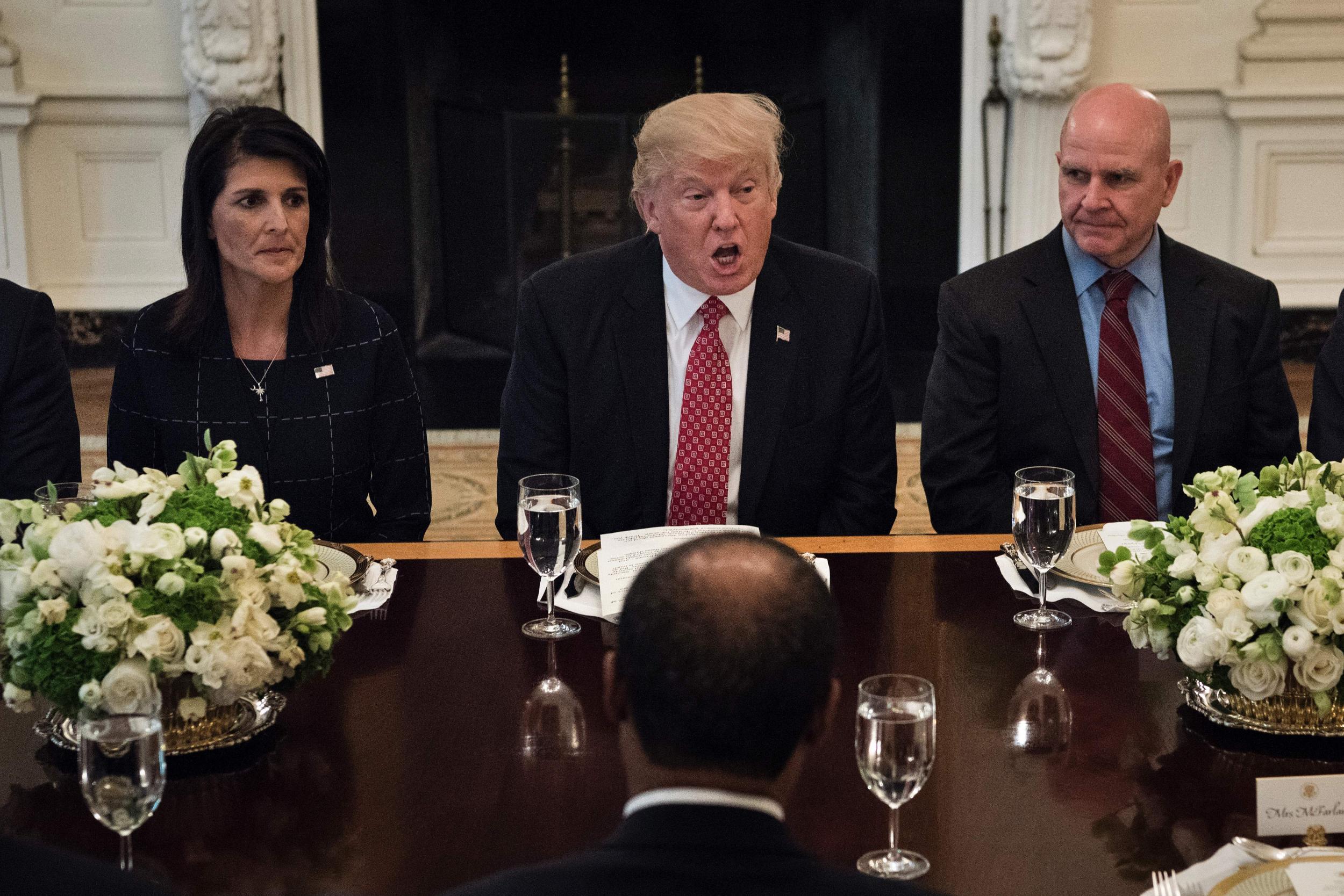 US Ambassador to the UN Nikki Haley and National Security Advisor HR McMaster listen as Donald Trump speaks before a working lunch with UN Security Council member nations at the White House