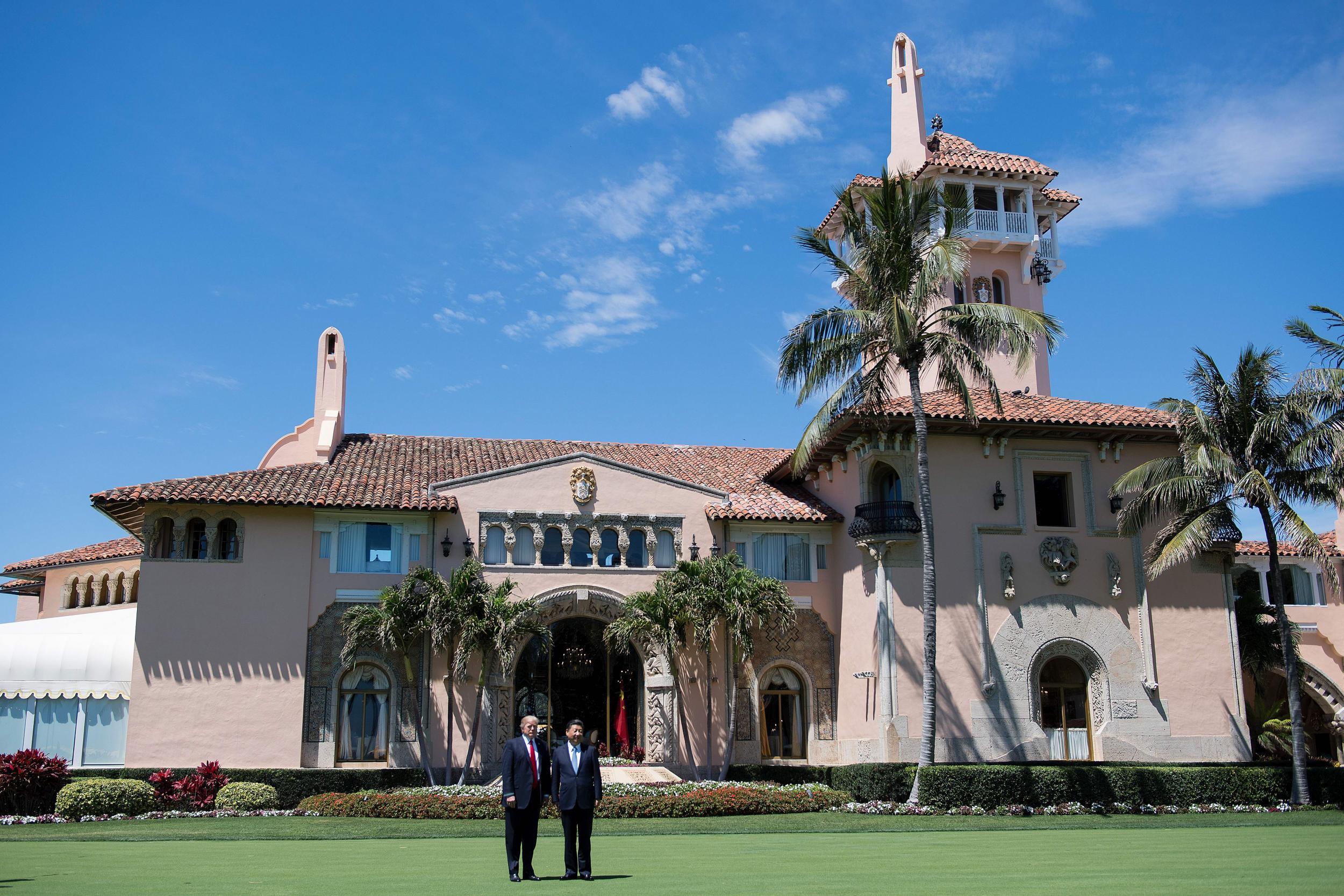 Donald Trump and Chinese President Xi Jinping pose together at the Mar-a-Lago estate in West Palm Beach, Florida