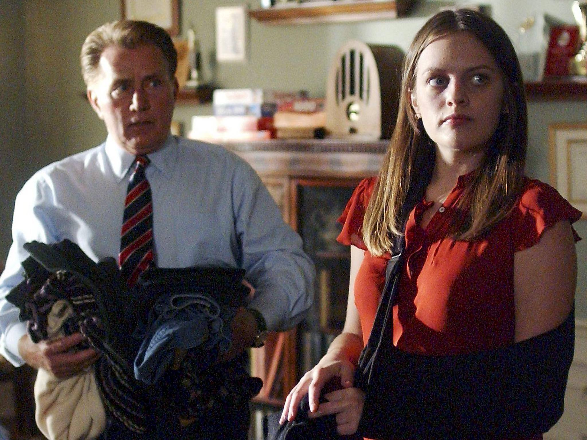 Moss as Zoey Bartlet in 'The West Wing' with Martin Sheen as her father, the president (NBC via Getty)