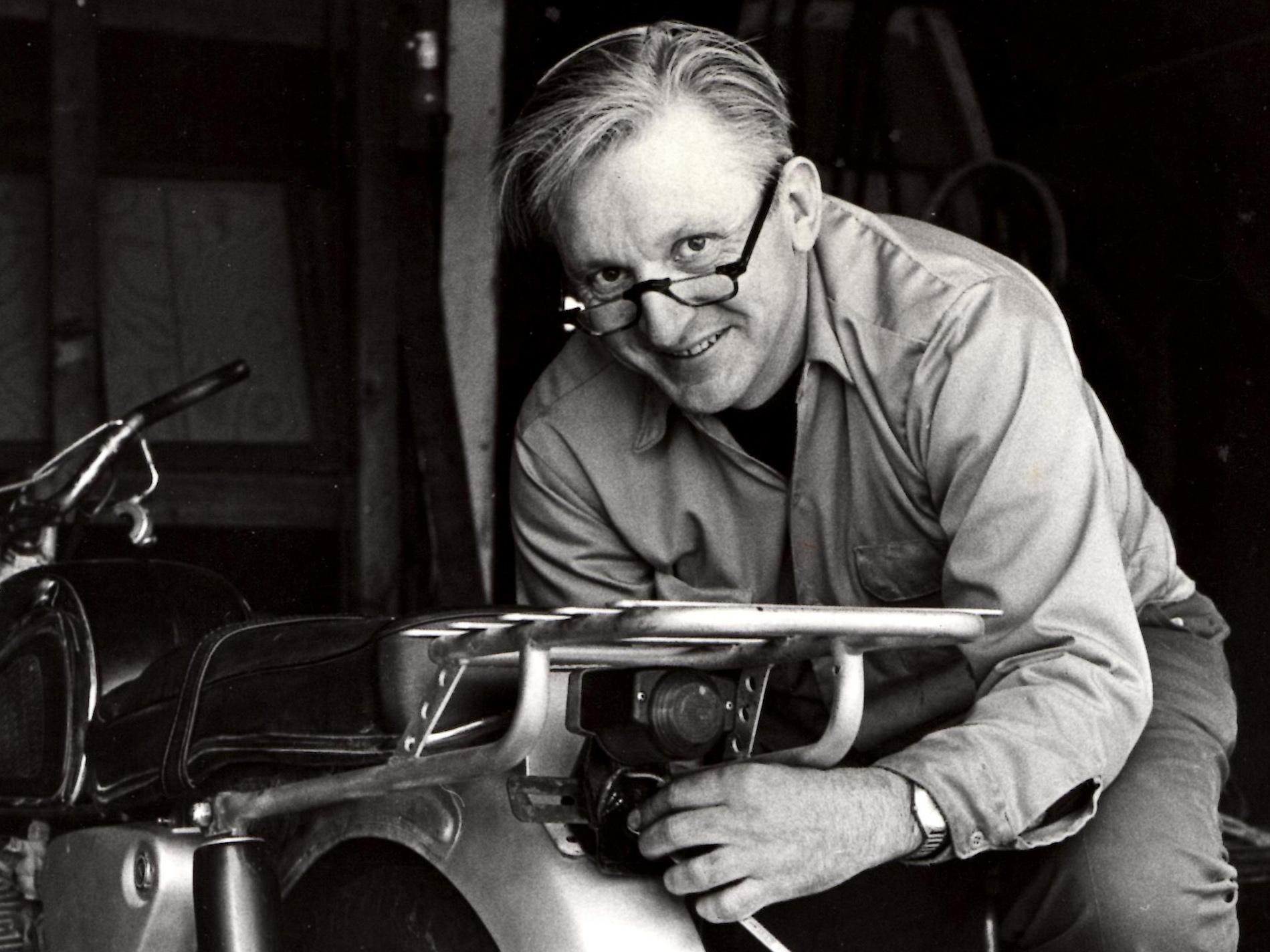 Author Robert M. Pirsig pictured working on his beloved motorcycle in 1975