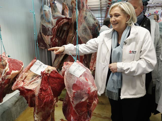 Marine Le Pen visits the meat pavilion at the Rungis international food market near Paris, France