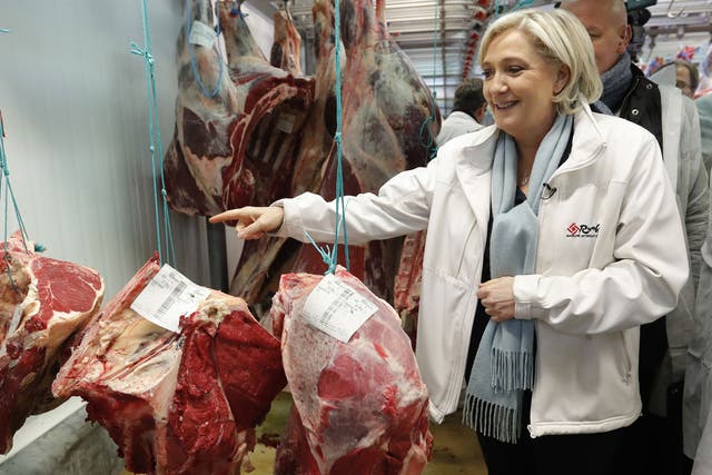 Marine Le Pen visits the meat pavilion at the Rungis international food market near Paris, France