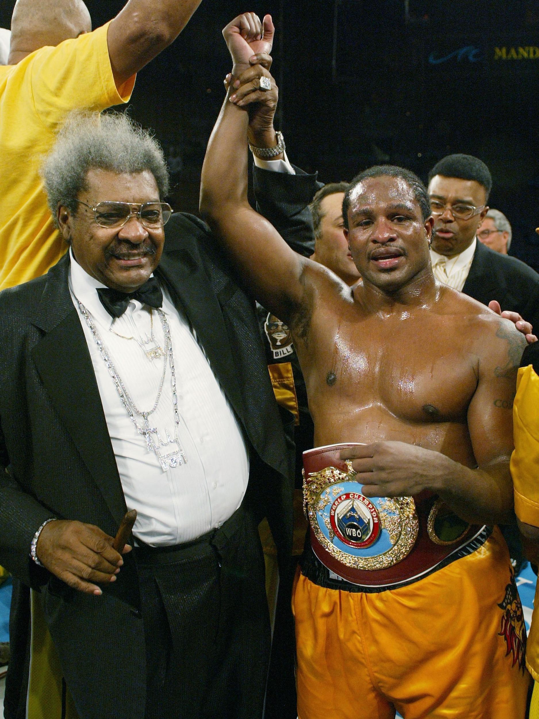 King holds up Brewster's arm after his win over Klitschko (Getty )