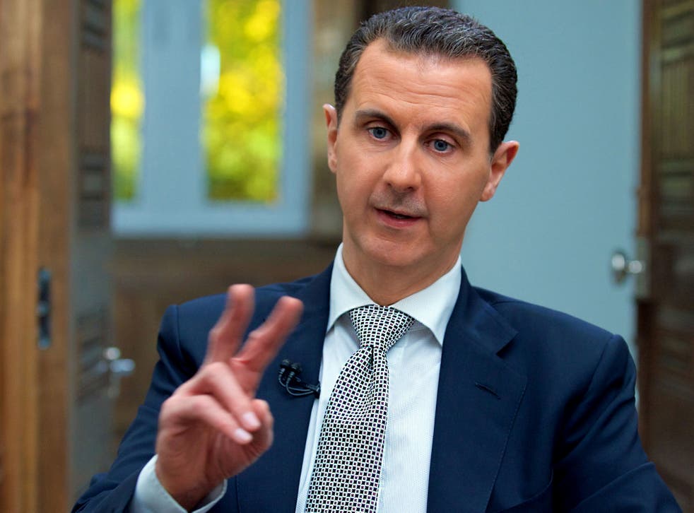 Syria's President Bashar al-Assad speaks during an interview with AFP news agency in Damascus