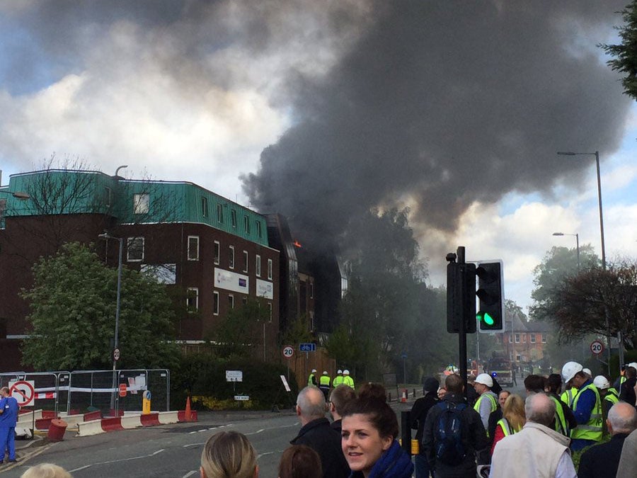 Smoke billows from the cancer research unit of Christie hospital in Manchester