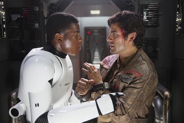 John Boyega as Finn (left) and Oscar Isaac as X-wing pilot Poe Dameron in ‘Star Wars: The Force Awakens’
