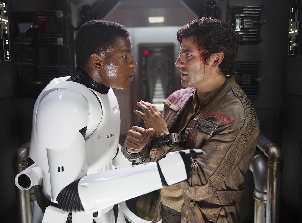 John Boyega as Finn (left) and Oscar Isaac as X-wing pilot Poe Dameron in ‘Star Wars: The Force Awakens’