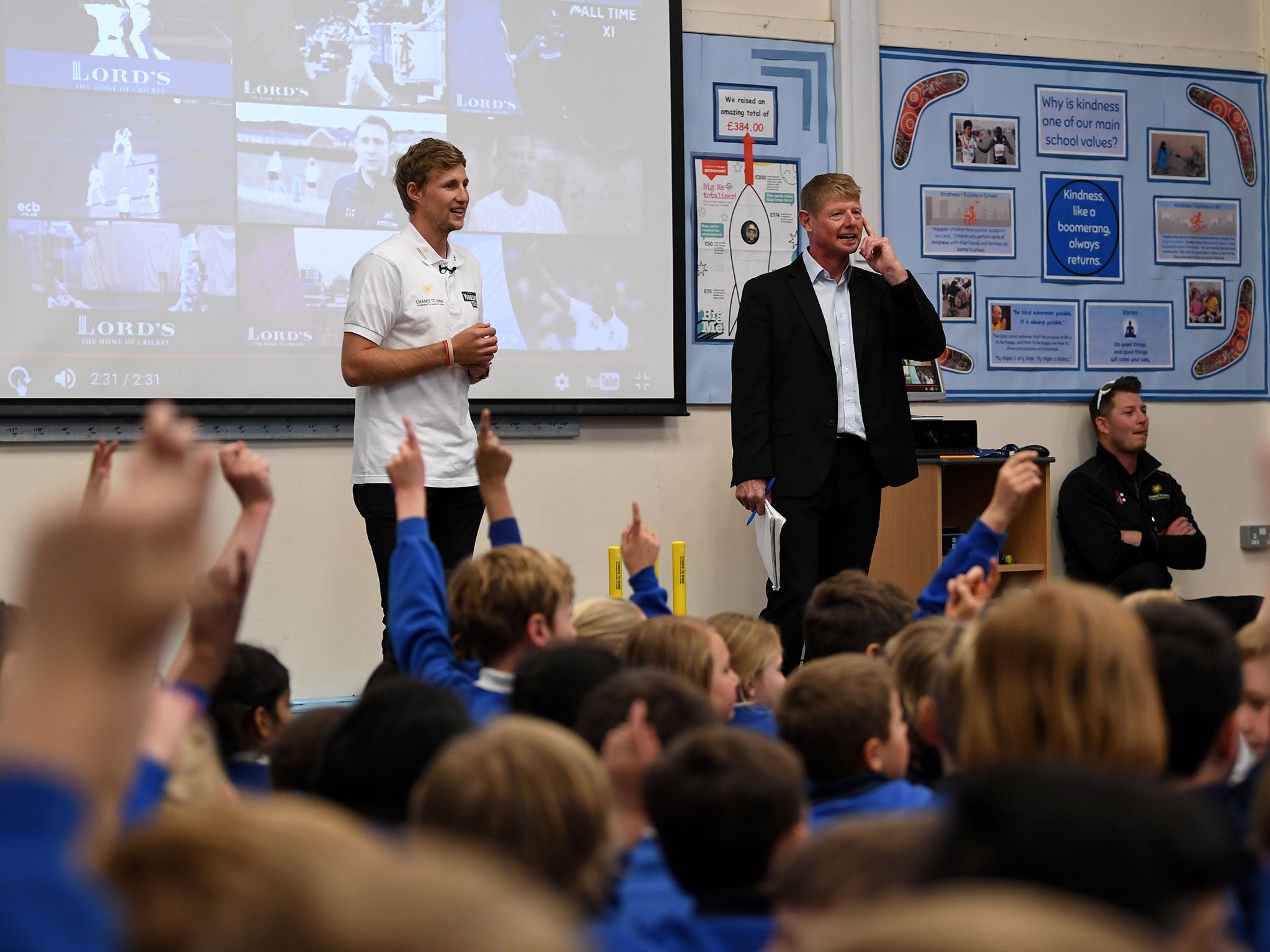 Root takes part in assembly as he visits his former school, Dore Primary School