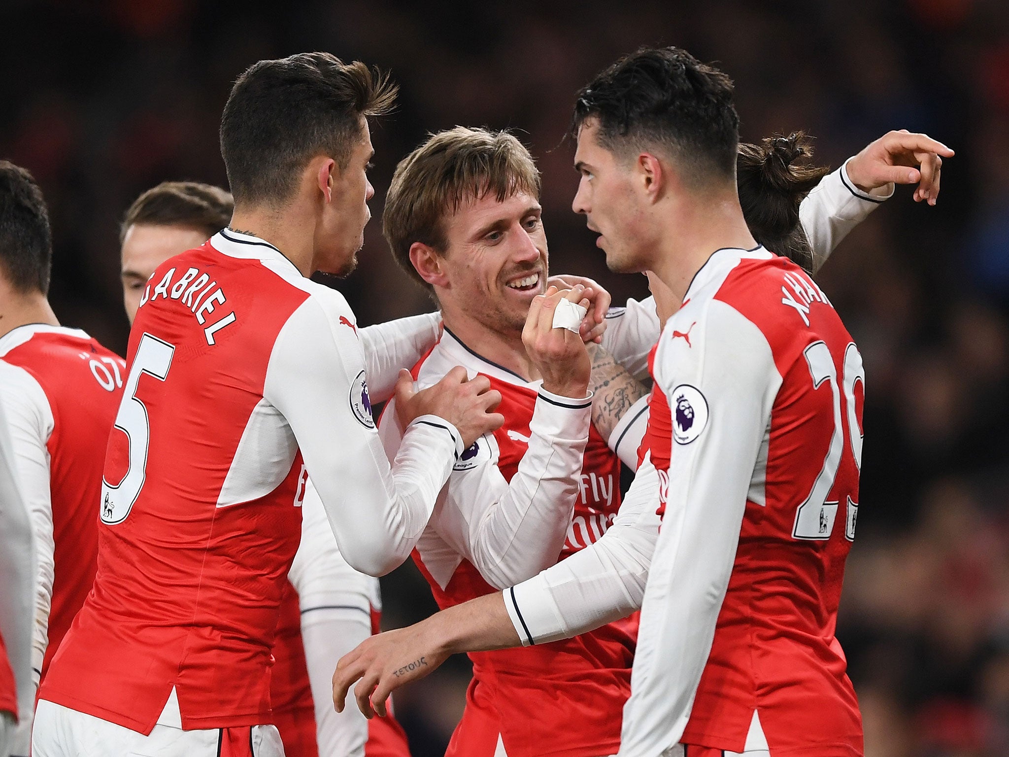 Arsenal's players celebrate following their late winner