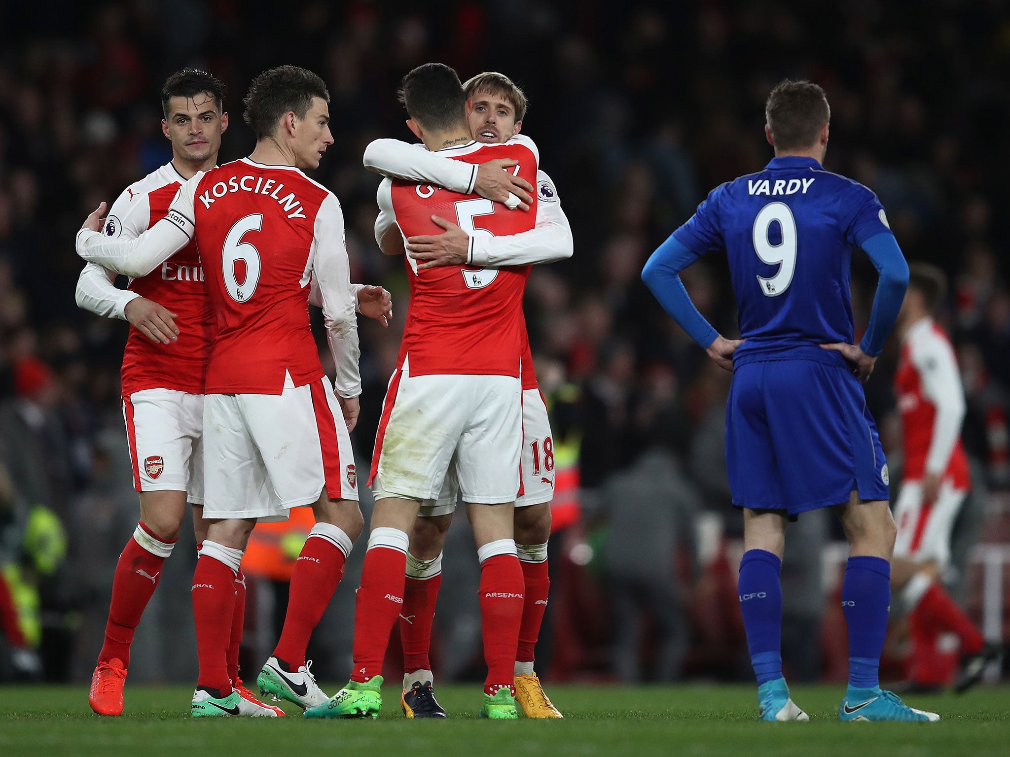 Arsenal's players celebrate after the final whistle