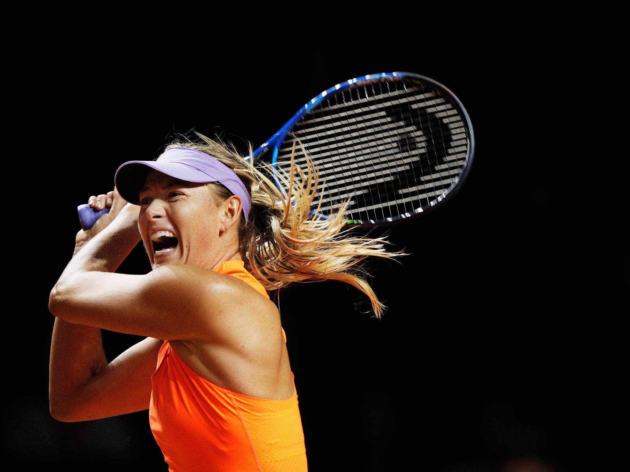 Sharapova plays a shot against Vinci in the second set