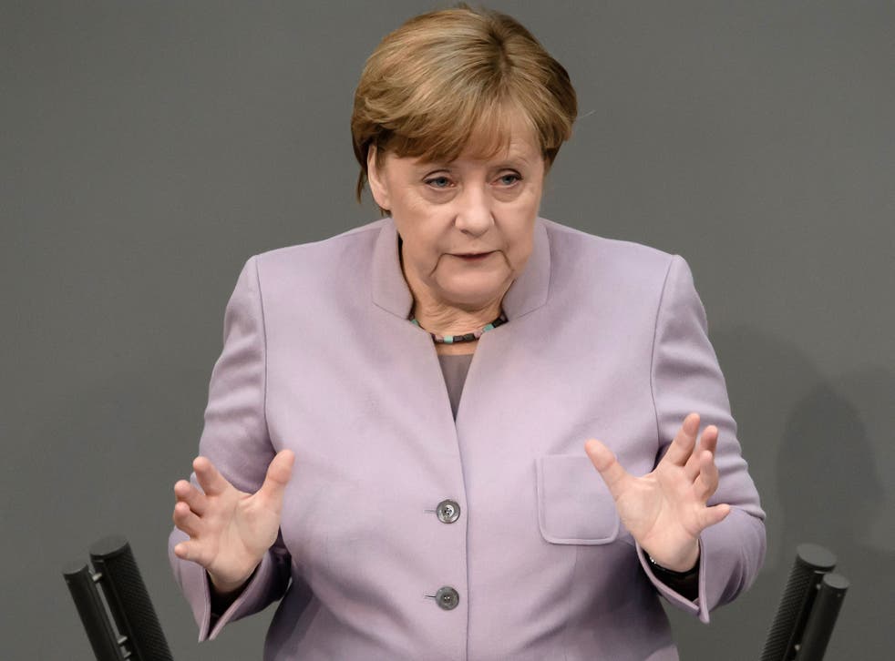 Angela Merkel addressing the Bundestag in Berlin on 27 April