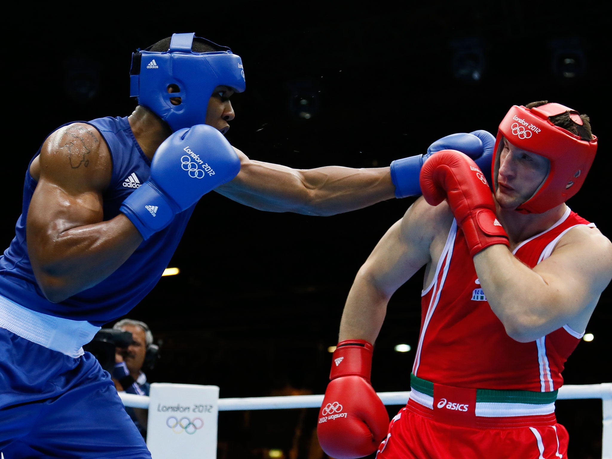Where it all started: Joshua in action during his 2012 Gold Olympic fight against Roberto Cammarelle