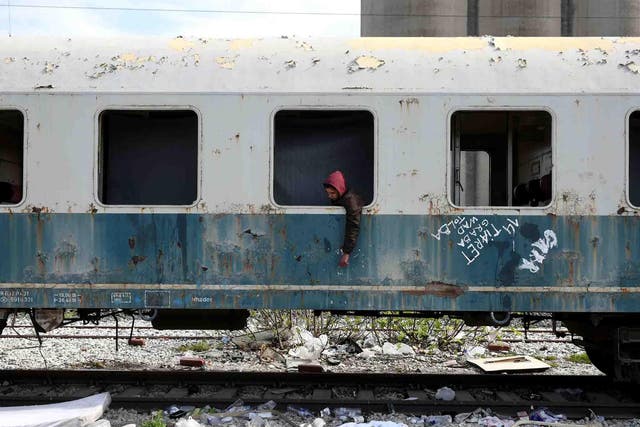 Habib, 22, from Algeria sits in an abandoned railway wagon used as a shelter by stranded migrants. Habib  arrived at the Greek island of Rhodes three months ago and he reached the mainland after hiding in a truck on a passenger ferry to Athens