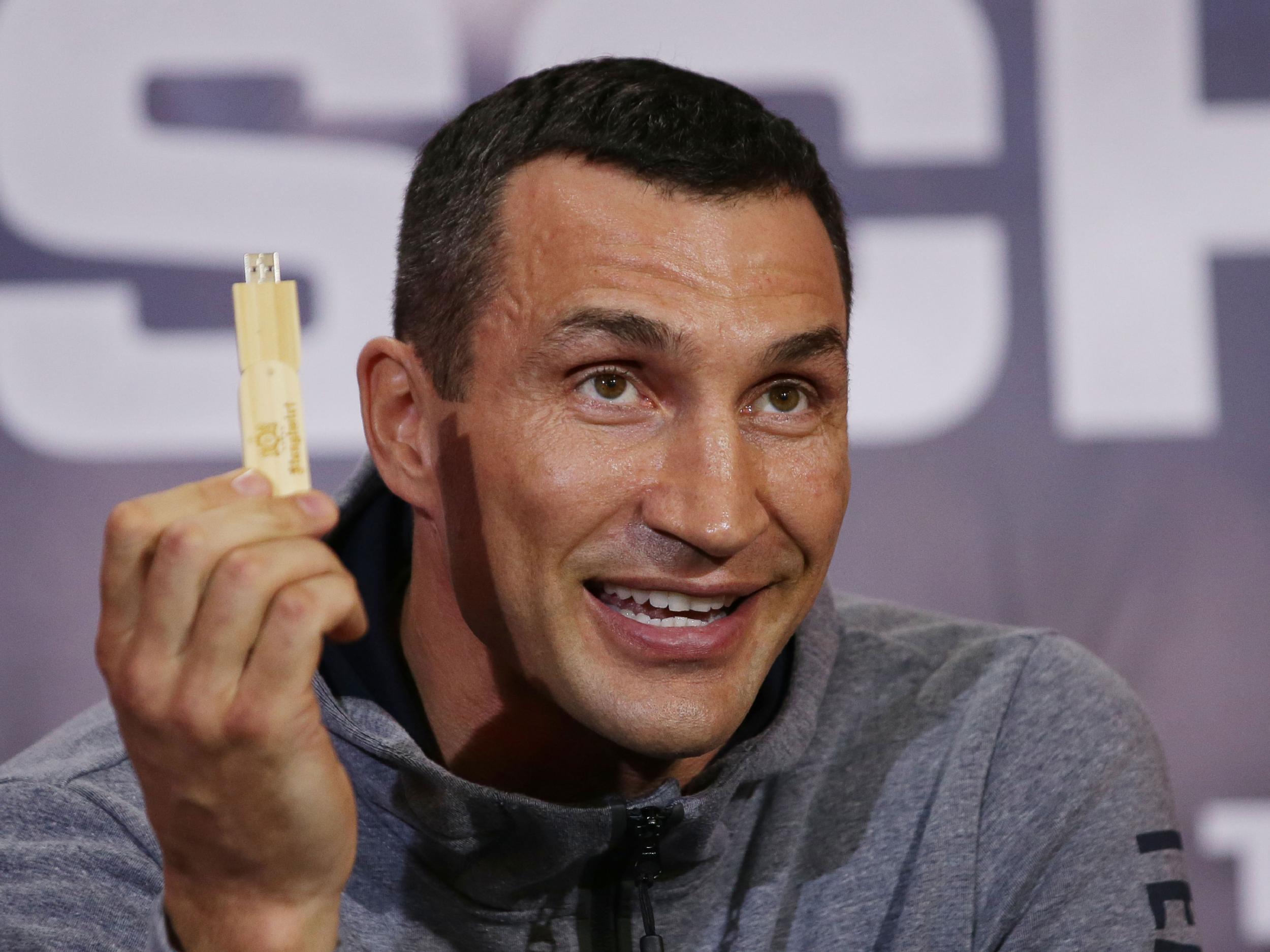 Wladimir Klitschko brandishes a USB drive with his fight prediction