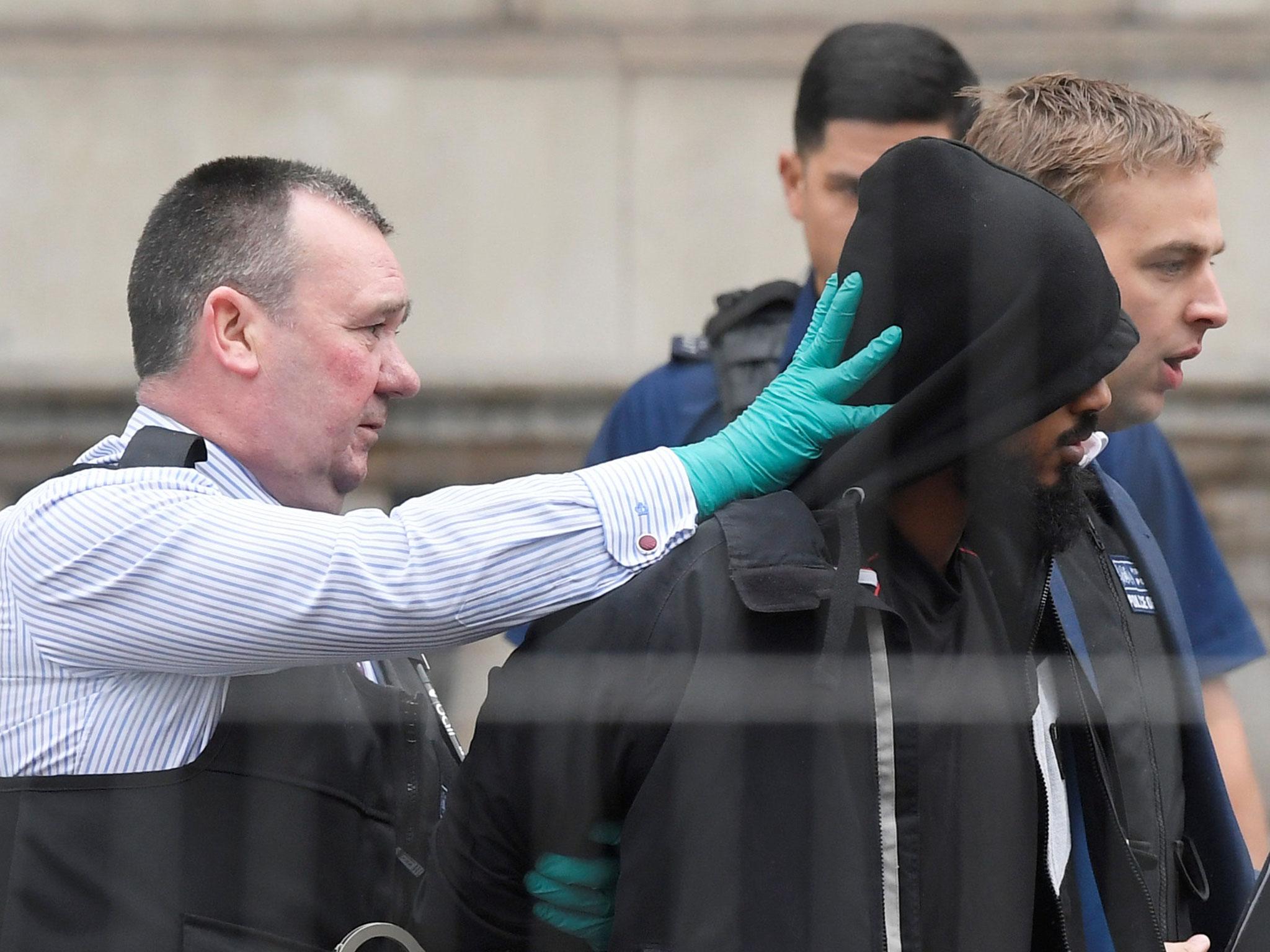 A man is led away by police in Westminster after an arrest was made