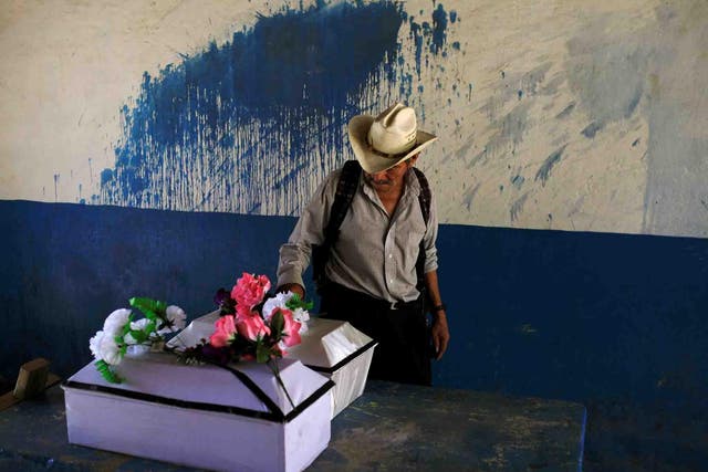 The remains of Petrona Chavarria and Vilma Ramos, who died in the El Mozote massacre, prior to their burial in the town of Jocoatique, in El Salvador